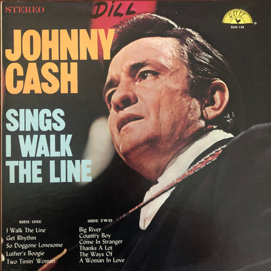 Sings I Walk The Line by Johnny Cash